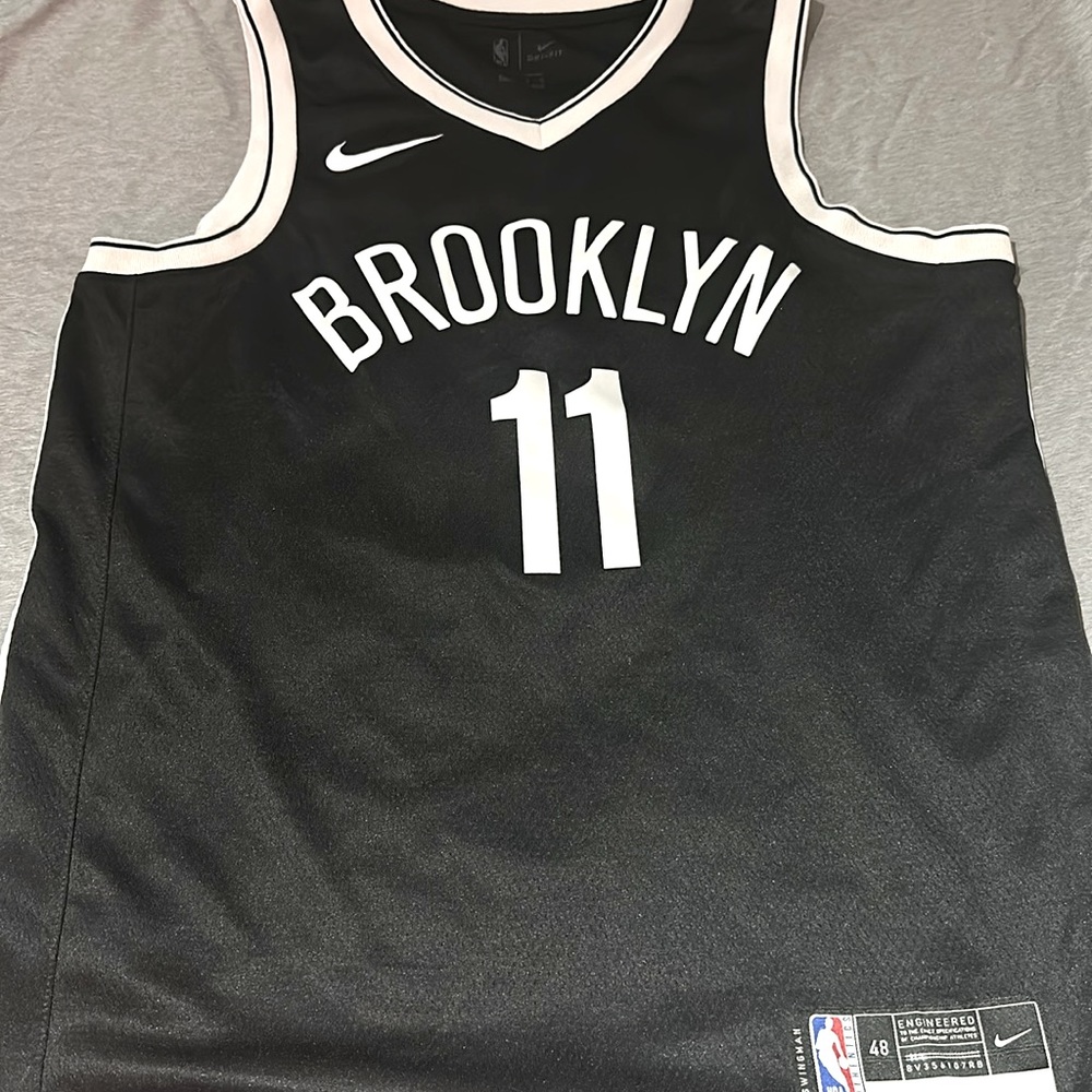 Size large swimgman #11 Kryie Irving Brooklyn Nets jersey.